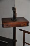 Antique cast iron shoe hole punch riveter mounted on stand