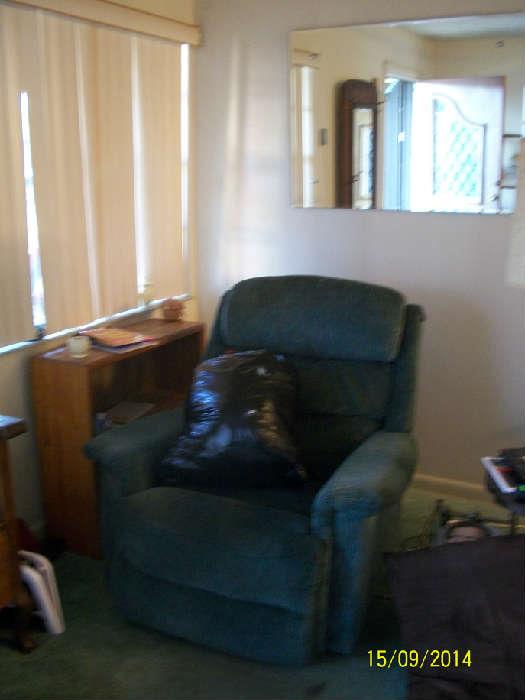 Laz-y-boy Blue recliner and small bookcase, wall mirror.