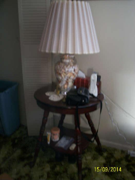 2nd shell lamp with antique side table has ball and claw feet.