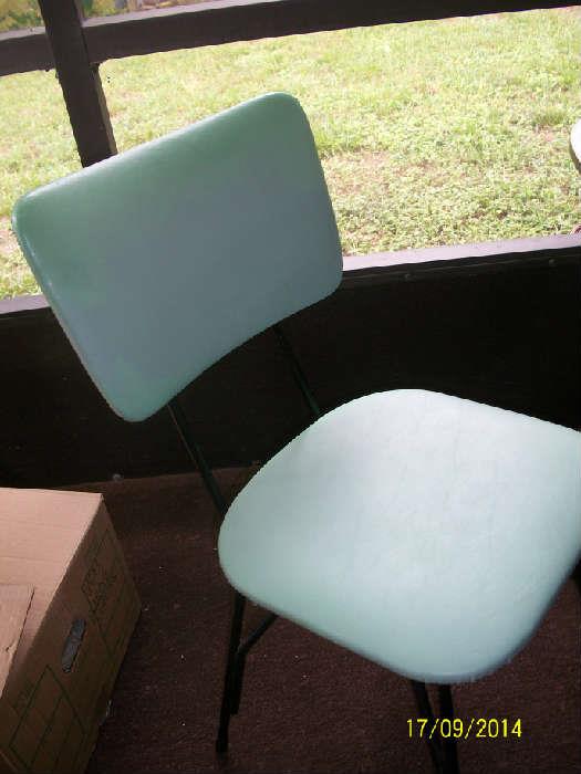 picture of chair - blueish / green color almost turquoise.