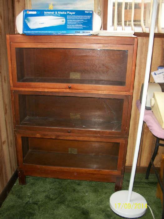 Barrister bookcase, middle cabinet glass is cracked in right hand lower corner.