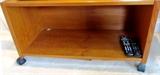 Teak TV Stand on caster mounts with bookshelf storage