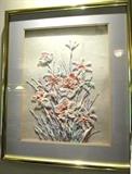 Nicely detailed raised relief artwork with beautiful flowers  and leaves...all made from organic items nicely painted in light pastels  complimenting one another.  Artwork is signed below the matting
