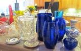 Some of the Excellent Glasswares in this sale...Including Cobalt Blue Vases and dishes made in Poland, Blenko Orange / Yellow Crackle glasswares, PMR Bavarian Vases, Vee Jackson blue / gold vase, good Cut Glass and Crystal items too; Also shown are fruit plates from Winterling, Germany, Blue Plates from Norway, H.P. Flower Plates from Germany, Flower Plates by Booths England (flowerpiece pattern), Goebel Bird Figurines, Capodimonte flower baskets, Ceramic Basket from Portugal, several Lenox and Wedgewood items , Dalmation Pamex from Romania, Leflor Birds; Many other items too