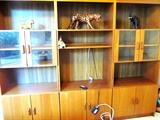 3  Scan Design Teak Bookcases ...two with glass & wood doored and shelves storage, other open shelves storage and lower double doored cabinet storage; One has large open shelf storage suitable for a TV , other open shelves storage and a lower double door cabinet storage.  Carved Animals shown are not available.
