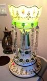 One of Two  Beautiful Matching Vintage Czechoslovakian Luster Accent Table Lamps...with crystal lusters...shown here lighted.   The lamp has  clear, white and green colors and hand painted floral accents with gold trim.  The other lamp is pictured elsewhere in this collection.  The silverplate pitcher also shown is also available.