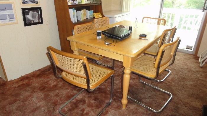 60" x 36" Dining room table with 6 cane chairs 