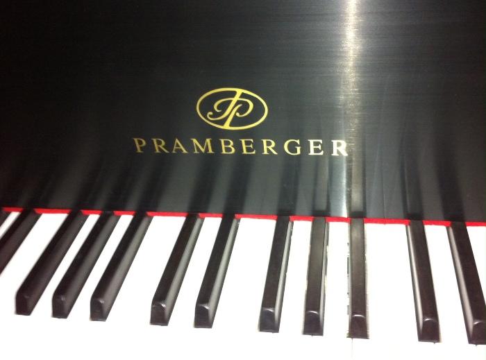 Pramberger baby grand piano with disc player, polished satin ebony finish. Beautiful sight and sound!