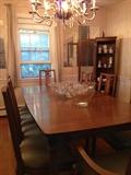 Dining room table. Chairs. Lighted curio cabinet. Glassware. Chandelier. Punch Bowls. Servers.