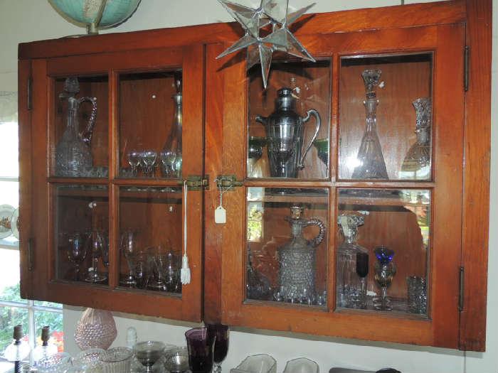hanging cupboard filled with barware