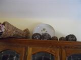 Cornicopia Decorations, Round Basket Woven Balls and Plate - on top of Oak China Hutch