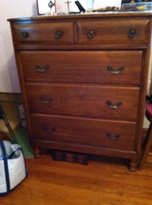 Solid wood chest of drawers.