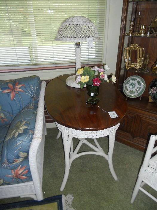 Oval wicker table with wooden top
