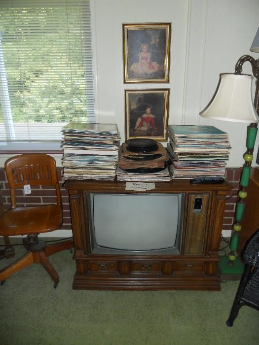 Many LP Records atop Console TV