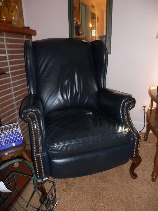 Navy leather chair with brass studs
