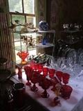 Colorful glassware; crystal stemware; silver-plate serving pieces;