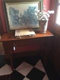 Small desk; art; floral arrangement;