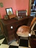 Another desk; peach-colored parlor chair; knick knacks; Asian décor;