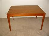 Mid Century Teak Dining Table with 2 leaves hidden under top.