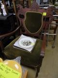 Carved chair w/green velvet upholstery