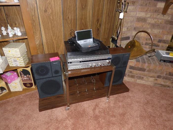 Stereo with stand, turntable, portable DVD player with remote and 2 sets of headphones.