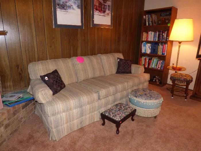 sofa, ottoman, footstool, lamp, book case and books