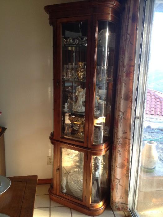 Beveled glass curio cabinet, contents not included. Walnut. $600