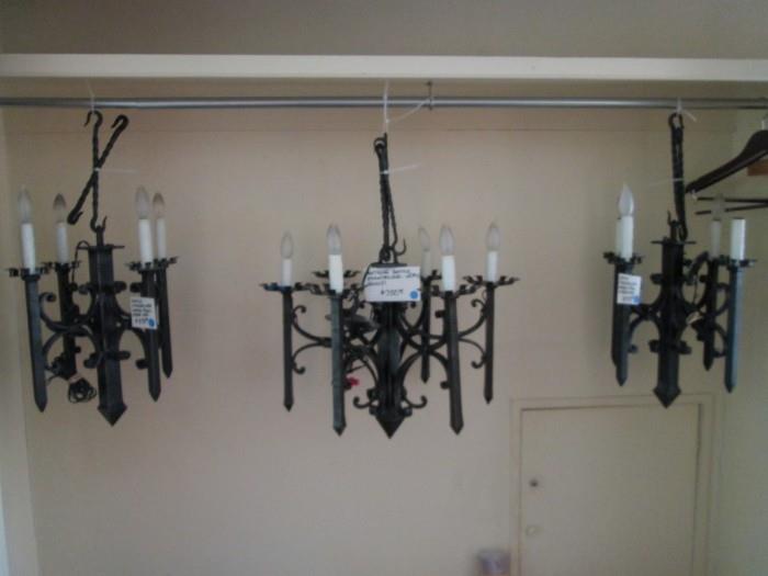 Center chandelier is an antique iron Gothic chandelier.  The two smaller chandeliers are copied from the original.