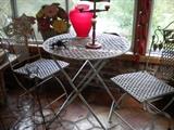 Folding wrought iron table and two chairs
