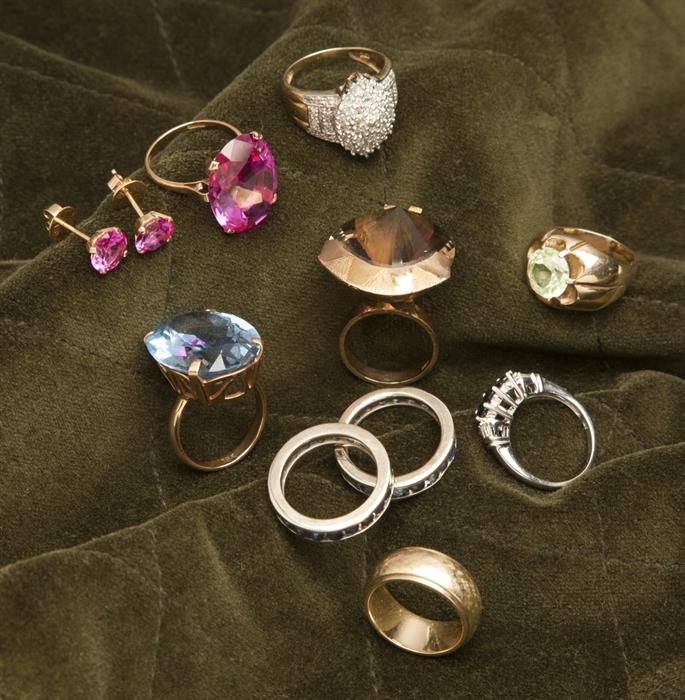 Assortment of unique rings, with various precious and semi precious stones, many with gold 