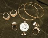 Gold rings and bracelets, jade pendant.
