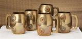 Inviting brass tankards, with bling