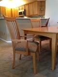 Contemporary dining table with 6 chairs, custom fabric, and leaf for extension.