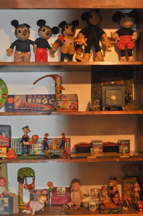 Mickey Mouse toys, Wolverine Marble Bingo, Magic Lantern, Chein Popeye puncher boxer, Girard Hand Car, Greyhound bus station, wind up crawling baby original box, Little Orphan Annie and Sandy miscellaneous items