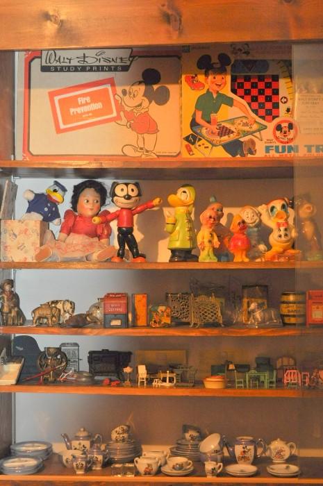 Mickey Mouse Disney fun tray, Donald Duck in a box, Snow White, Felix the Cat, chalk Disney figurines, Buster Brown and his dog Tige, bank collection, Tootsietoy doll furniture, Arcade iron doll furniture, various children's doll dishes, Line-Mar dishes