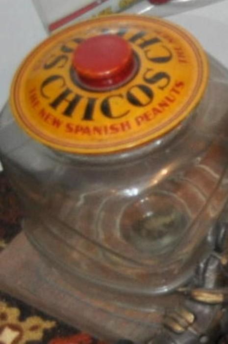 Chicos Spanish Peanuts -- advertising jar with metal lid on wood base.