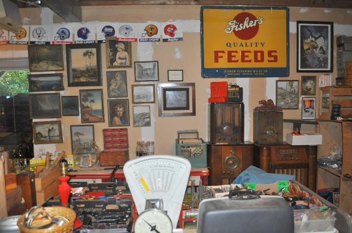 Another view of some of the great old framed art, a better picture of the Fisher's Quality Feeds sign (old), a couple of radios, and more neat stuff in the foreground.