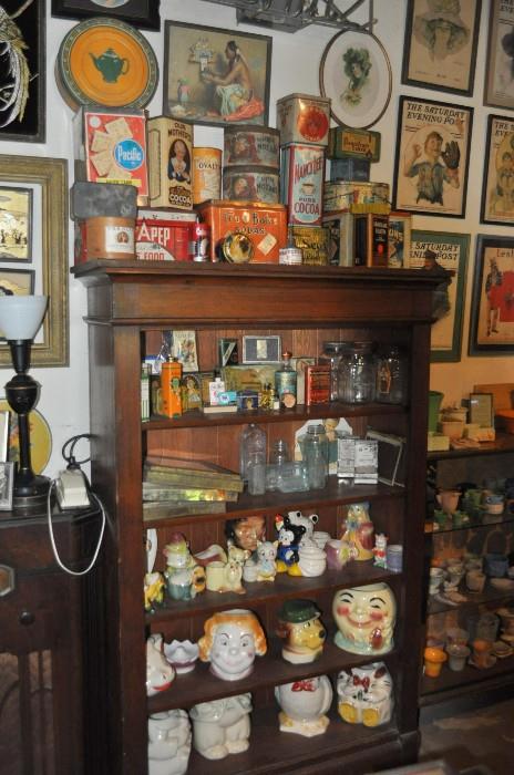 I love this shelf/cabinet!  It's old-growth fir I believe, and it's full of some great old -- really old -- tins, glass-toppers for biscuit tins, old medicine bottles, planters, and an array of cookie jars...  