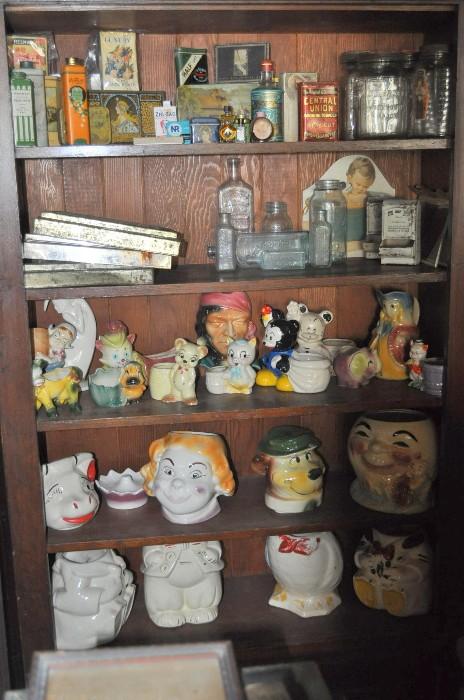 Like I said... I love this shelf/cabinet!  It's old-growth fir I believe, and it's full of some great old -- really old -- tins, glass-toppers for biscuit tins, old medicine bottles, planters, and an array of cookie jars.  