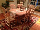 handmade table with several leaves. rug not for sale
