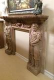 Lot 1029:  CARVED FIGURAL ROSSO VERONA MARBLE FIRE SURROUND: Shaped pediment, carved figural neo-classical figures on supports, insert with figural cherubs, bird and floral swag. Sold with 2 marble spacers. Overall measures approx. 62 3/4'' h. x 82'' x 14 3/4'', opening 45 1/2'' h. x 35''.
CONDITION: Several repairs marble, shipper note VERY heavy, separates into 8 sections for transport.