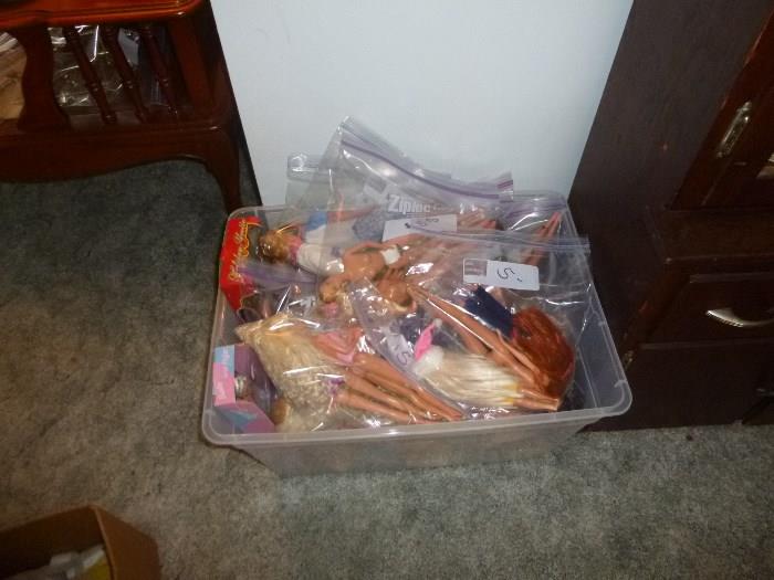Tote full of Barbie and Ken dolls......