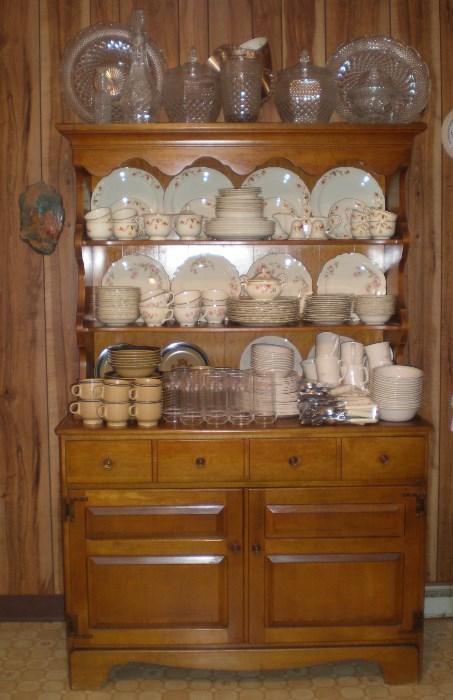 Beautiful Maple Hutch, on the top is Wexford Glass (cookie jars sold, rest available), next shelf is Autumn Leaf Dishes (sold), next shelf is Homer Laughlin Virginia Rose Dishes (available), next is stoneware (sold) & Corelle dishes (sold).