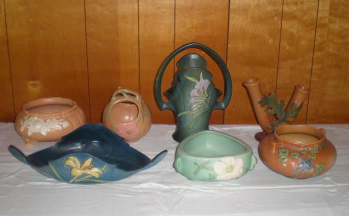 Three pieces of Roseville, Blue Zephyr Lily Bowl, Green Freesia Basket, Sand Brown Columbine Bowl,  one piece of Weller Pottery sold three are left.