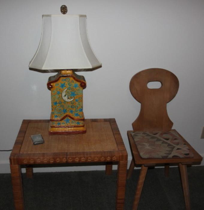 Great "sun/moon" pottery table lamp, on well-made wicker table, next to one of a pair of custom-made German chairs