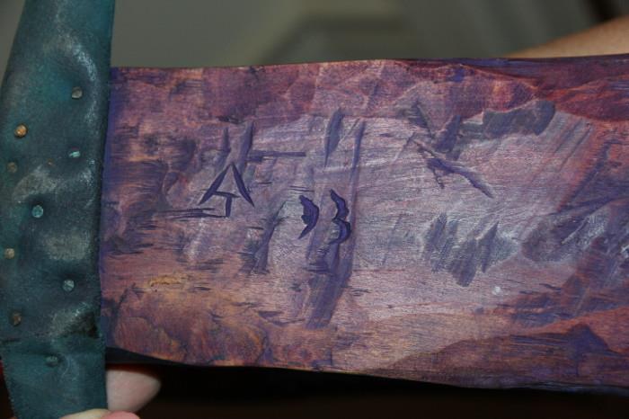 signature on folk art angel