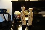 CARVED SOAP STONE FIGURES AND N THE BACKGROUND ARE SEVERAL PIECES OF CLOISONNE