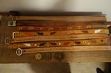 COLLECTION OF HAND TOOLED LEATHER BELTS AND BUCKLES