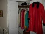 one of four closets, 1 walk in closet and four rolling rack of almost new clothes--many still with tags--LEATHER AND MINK red swing coat