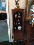 precious curio cabinet with a lovely bird figurine collection
